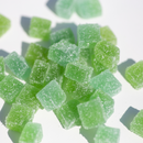 Kush Queen Watermelon THC and CBD gummies with a sugary coating on a white background.